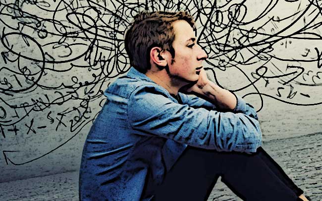 jeune adolescent qui pense assis par terre