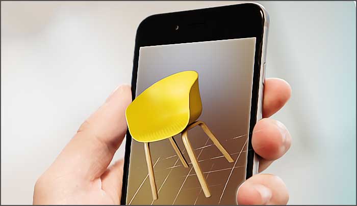 Main tenant smartphone avec image de chaise.